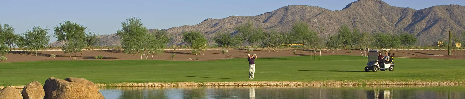 Image of golf ball on tee on grass.